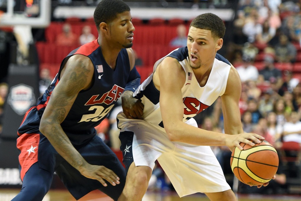 Paul George tries to block Klay Thompson's pass during the exhibition before George's injury in Las Vegas. Photo: AFP