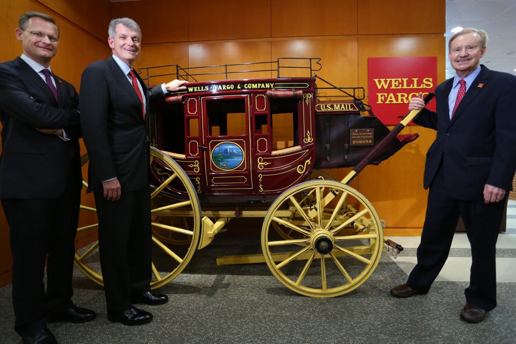 Wells Fargo's Richard Yorke (left), head of wholesale banking Timothy Sloan (second from left) and Asia-Pacific president John Rindlaub pose for a photograph. Photo: Nora Tam