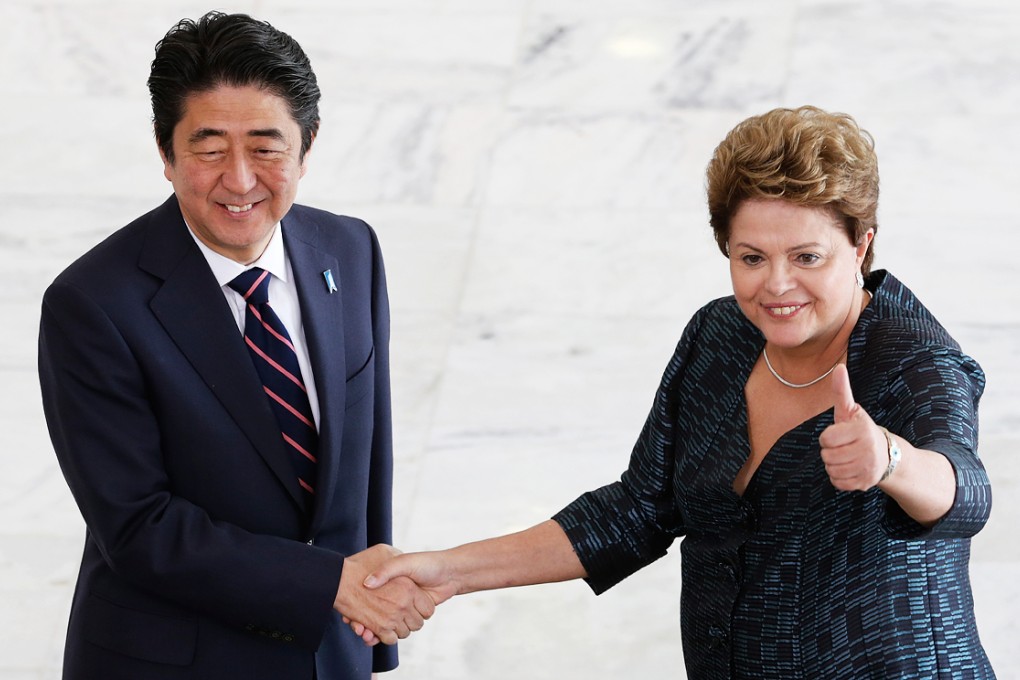 Japan's Prime Minister Shinzo Abe shakes hands with Brazil's President Dilma Rousseff at the Planalto Presidential Palace, in Brasilia, Brazil. Photo: AP