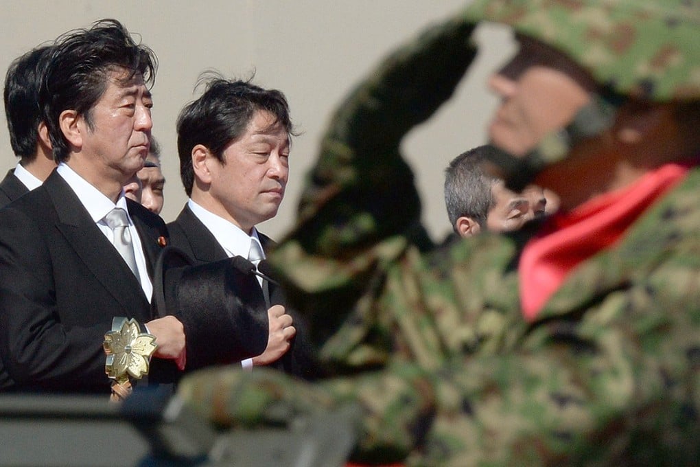 Japanese Prime Minister Shinzo Abe (left) has vowed to beef up the country's Self-Defence Forces amid concerns over China's growing threat. Photo: AFP