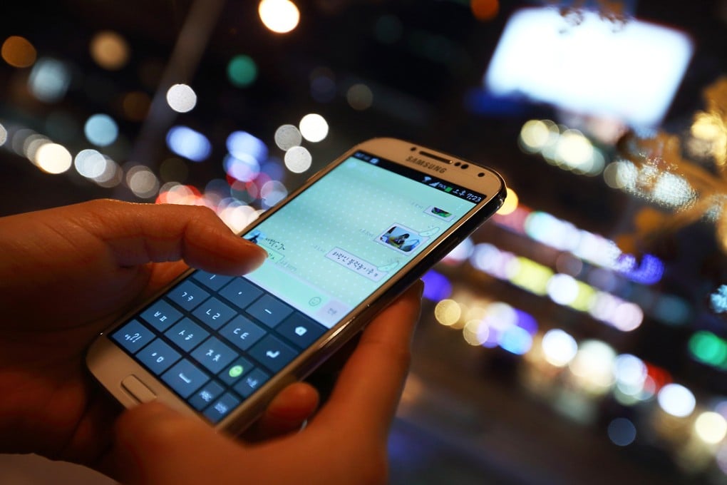 A woman uses the messaging app KakaoTalk. Its services have been disrupted in China, according to the company and technology experts. Photo: Bloomberg