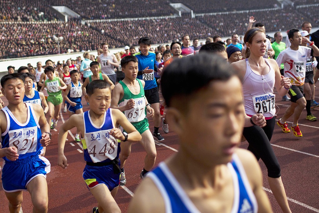 Runners take off inside Kim Il-sung Stadium at the beginning of the Mangyongdae Prize International Marathon in Pyongyang. Photo: AP