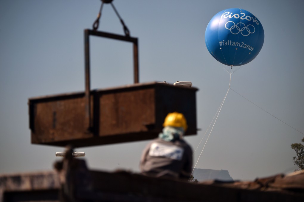 A balloon depicts pictograms and logos of the 2016 Rio Games at the construction site of the Olympic park. Photo: AFP