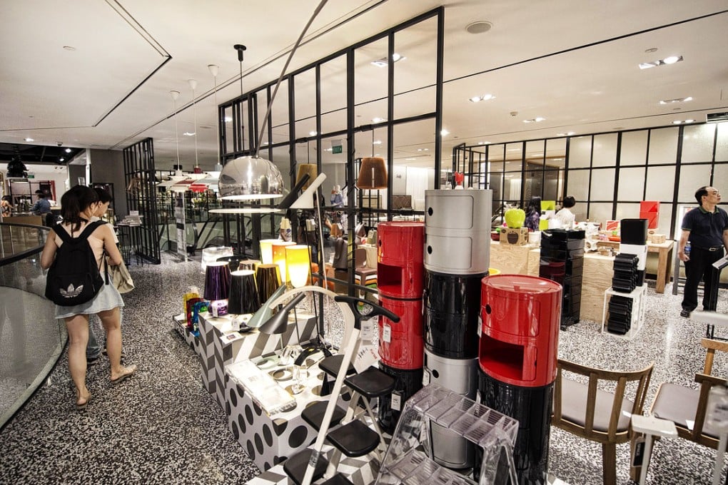 Shoppers walk through Robinsons department store in Singapore, where prices are 10 per cent higher than in Hong Kong. Photo: Bloomberg