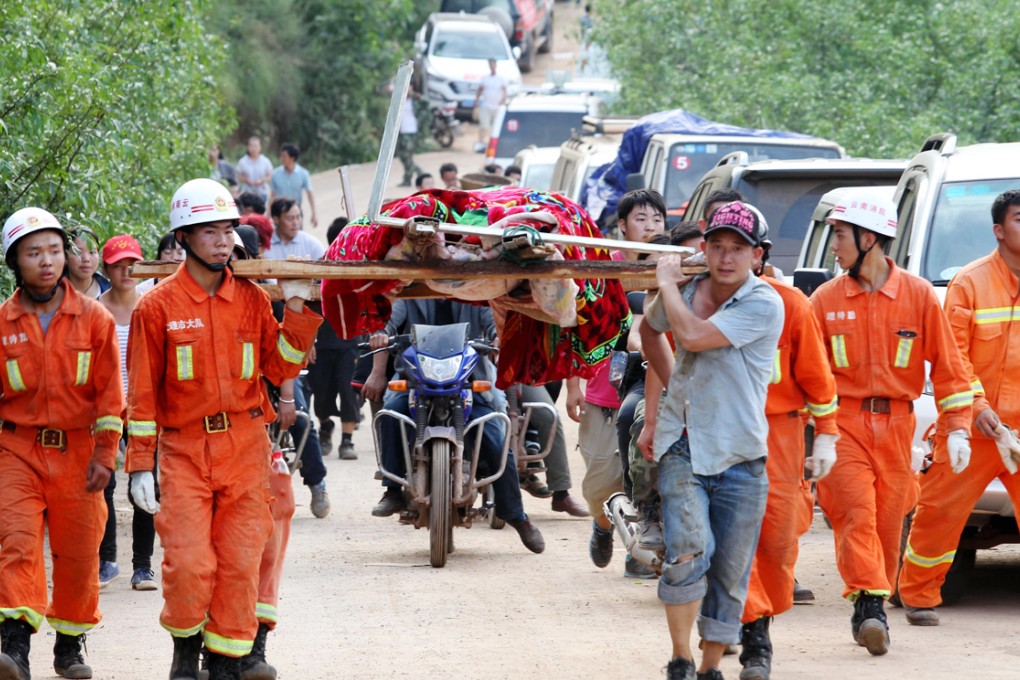 The only link from Longtoushan to the outside world is through a single muddy road, six metres across, but access has been blocked by landslides. Photo: Simon Song