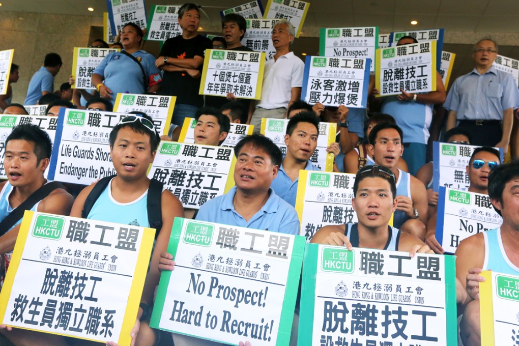 Lifeguards stage a sit-in protest at the headquarters of the Leisure and Cultural Services Department in Shatin.