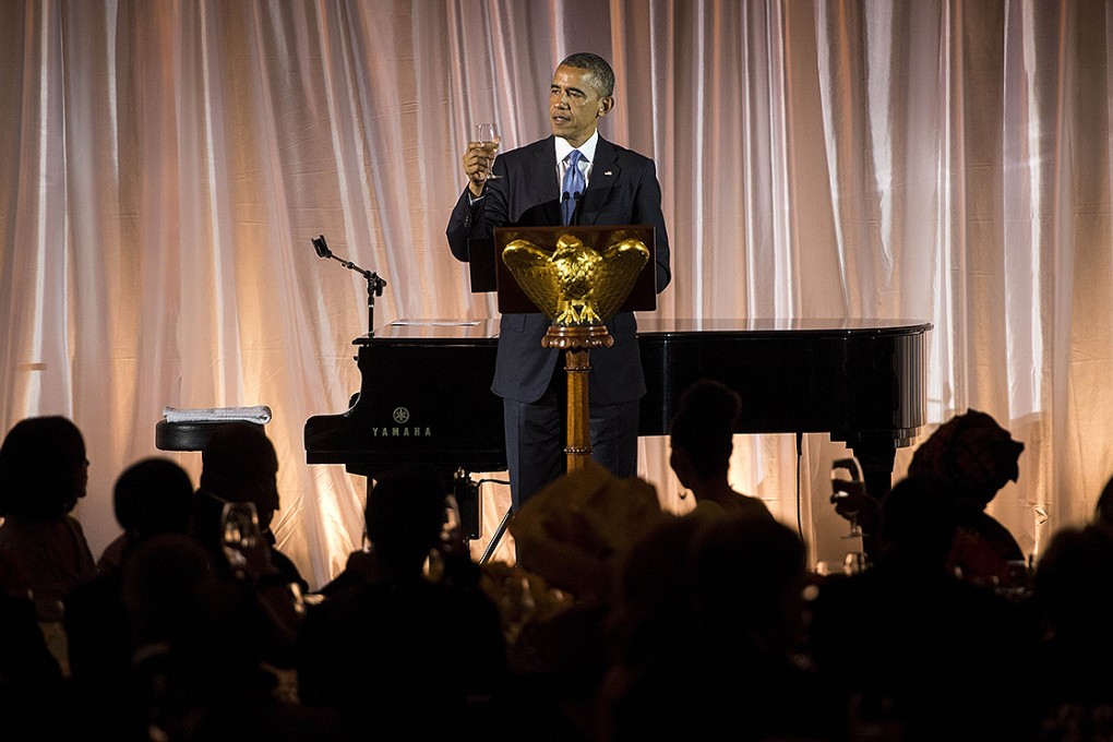 US President Barack Obama makes a toast during a dinner for participants of the US Africa Leaders Summit. Photo: AFP