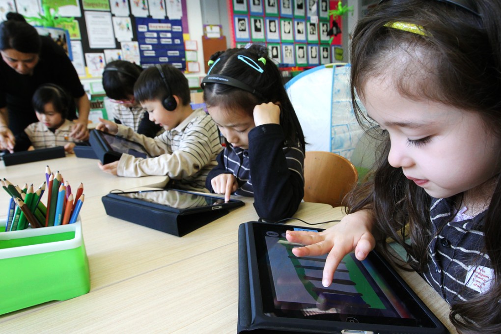 Born in the new millennium, these children have never known the dark ages of dial up internet, and the youngest are learning how to operate smartphones or tablets before they can talk. Photo: Edward Wong