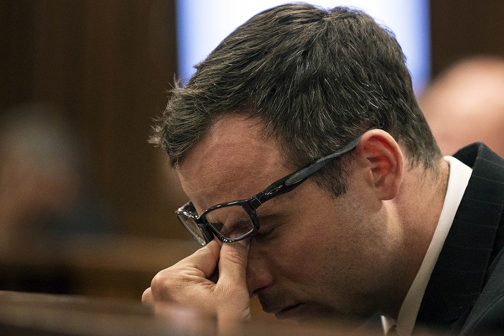 Oscar Pistorius gestures during the final arguments of his murder trial at the High Court in Pretoria. Photo: AFP