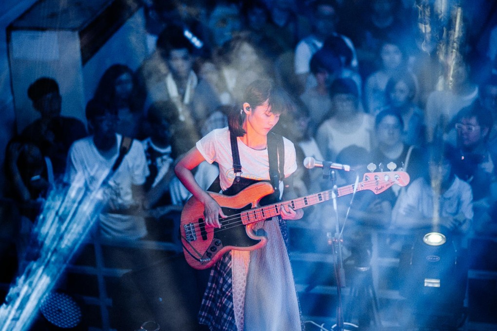 Tif Chang's bass underpins the band's sound.