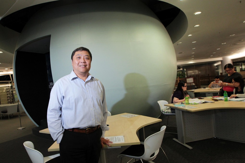 Steve Ching stands in front of City University library's egg-shaped theatre. Photo: Bruce Yan