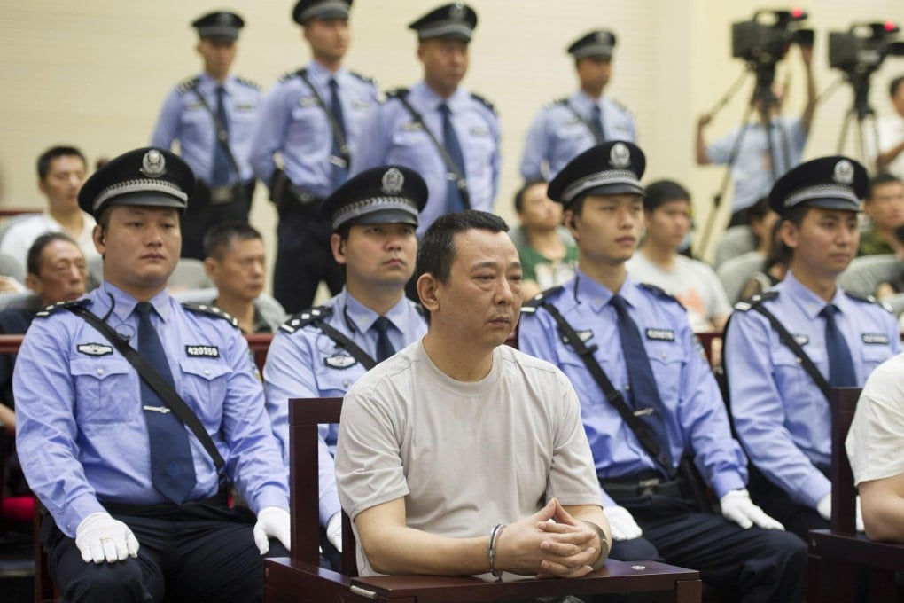 Liu Han was heavily guarded during the trial. Photo: Xinhua