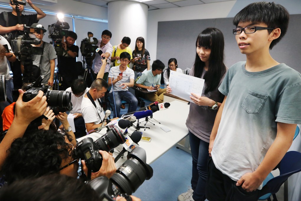 Scholarism student activists Agnes Chow Ting (left) and Joshua Wong Chi-fung (right), meet the press after recevied their results of the Diploma of Secondary Education (HKDSE) examinations. Photo: Felix Wong