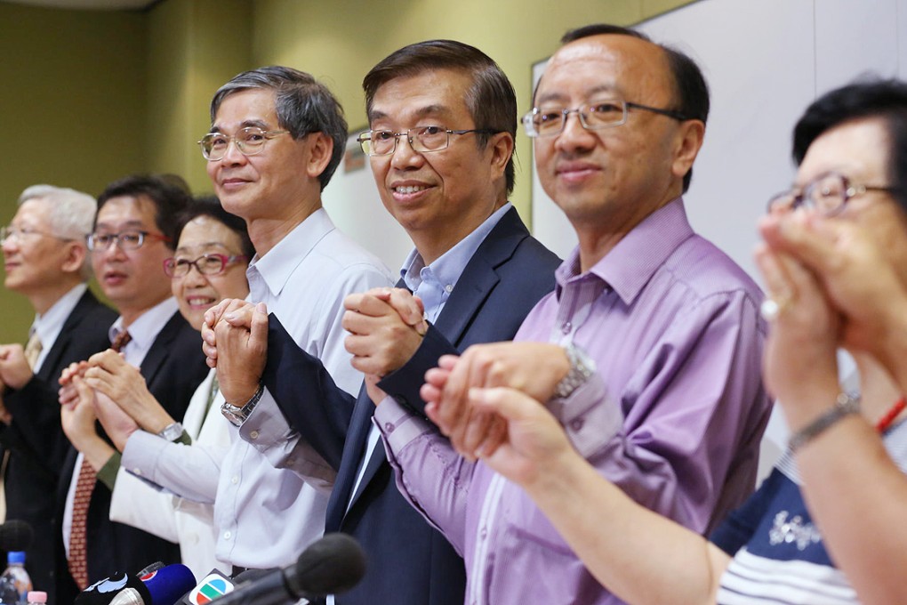 Signatories including coordinator Andrew Fung (centre, in jacket) launch the petition. Photo: Nora Tam