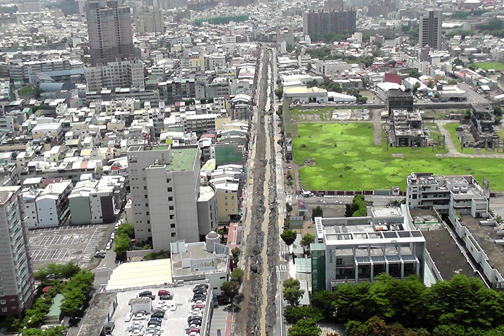 Aerial photo shows the evacuated area around a road ripped up by underground gas explosions in Kaohsiung on August 2. Photo: EPA
