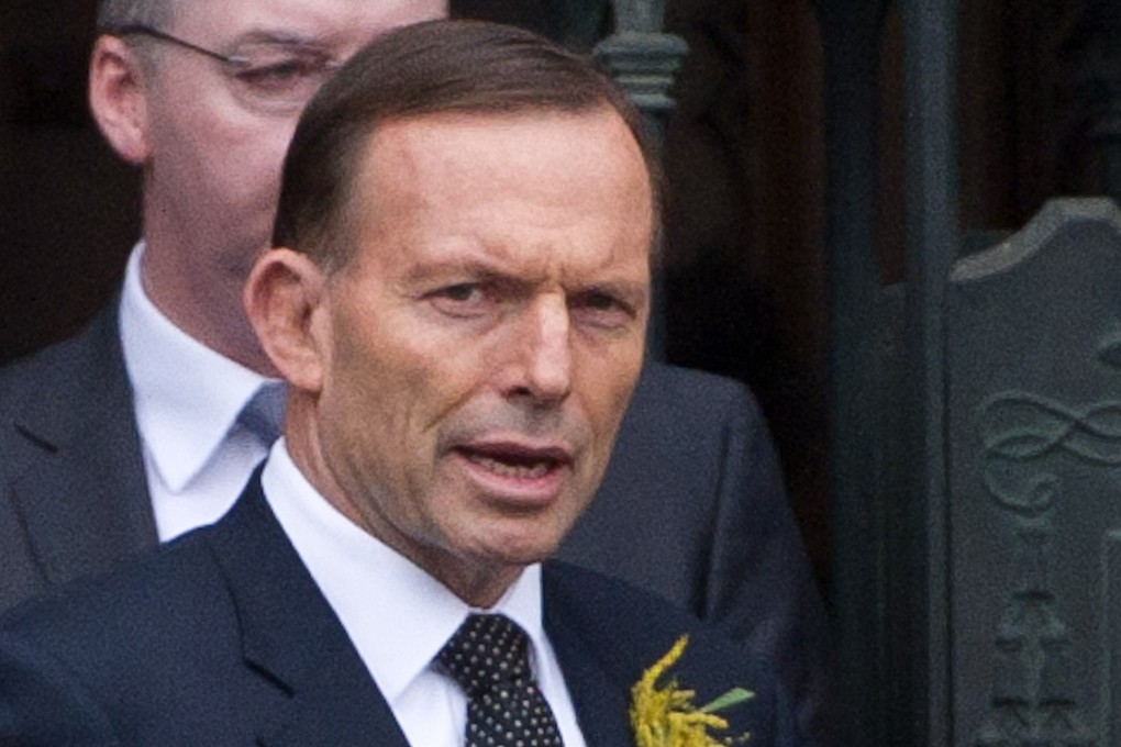 Tony Abbott leaves St Patrick's Cathedral in Melbourne after a memorial service for victims of Malaysia Airlines flight MH17 on Thursday. Photo: Xinhua