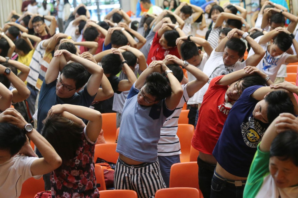 Warm-up exercises at yesterday's briefing session. Photo: David Wong