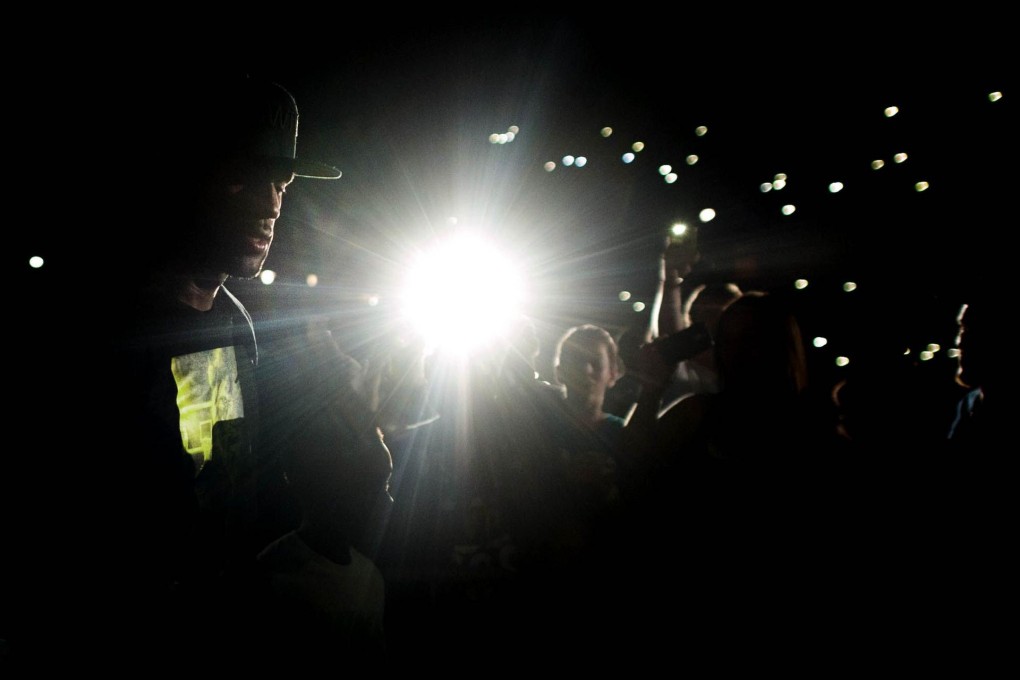 LeBron James in the spotlight at an event in Akron. Photo: AFP