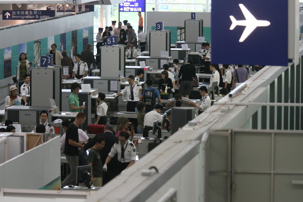 Staff keep busy at Hong Kong's airport. Photo: Ricky Chung