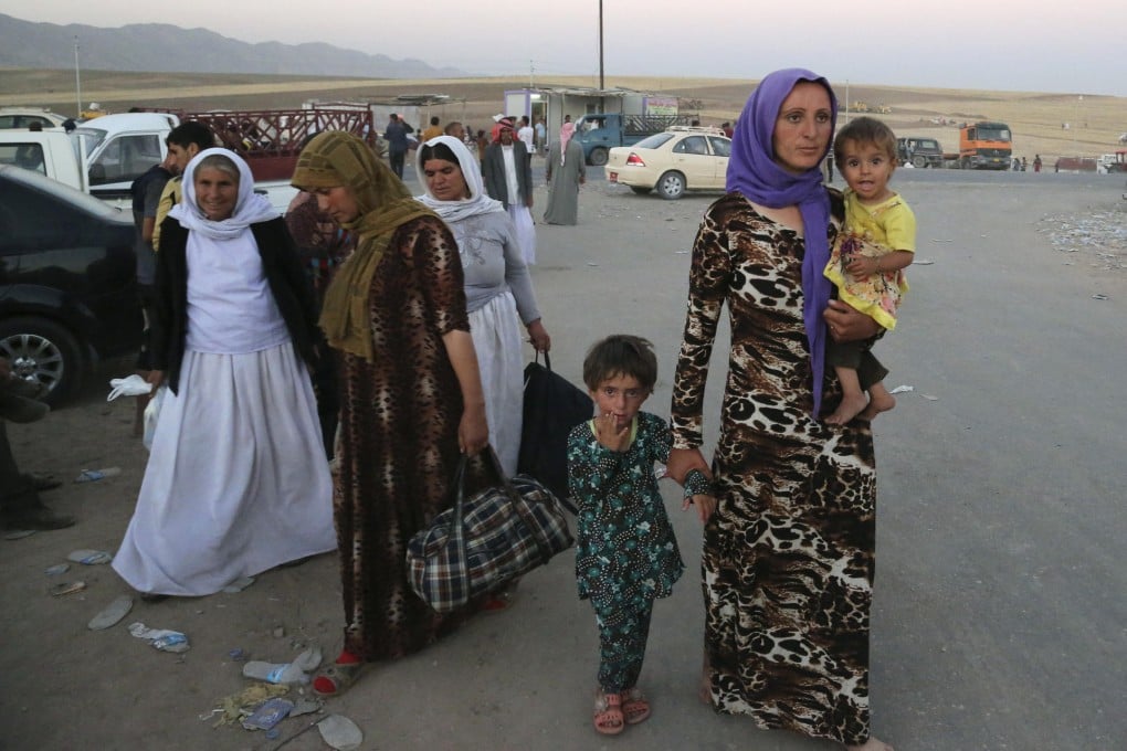 Displaced Yazidis at a camp near the Syria-Iraq border. Photo: AP