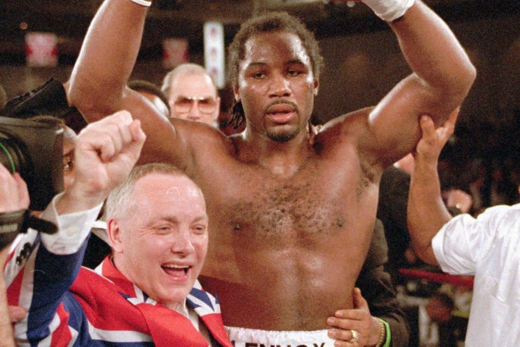 Frank Maloney celebrates with Lennox Lewis after Lewis beat Oliver McCall to win the vacant WBC heavyweight title in February 1997 in Las Vegas. Photo: AP