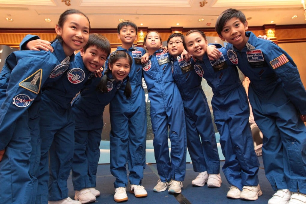 Young astronauts, from left: Bernice Cheung, Nathan Ng, Bridget Chan, Arthur Chan, Rachel Cheung, Marco Liu, Alexa Ma and Jason Cheung completed the Junior Space Camp Programme. Photo: Bruce Yan