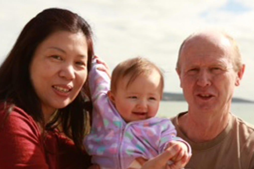 The Farnells, above with Pipah, claim that the surrogate threatened to keep both of the children if they tried to take Gammy. Photo: AP