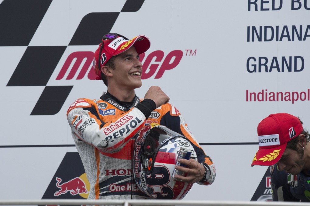 Marc Marquez  celebrates on the podium after winning the MotoGP event at the  Indianapolis Grand Prix. Photo: AFP