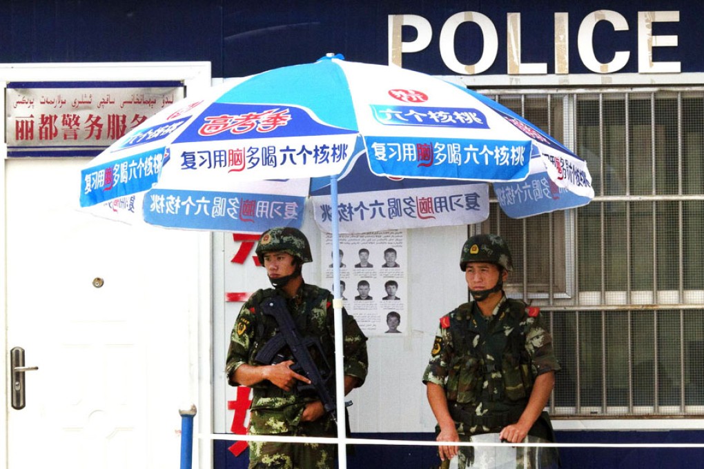 Paramilitary police stand on duty in Aksu, eastern Xinjiang. Photo: AP