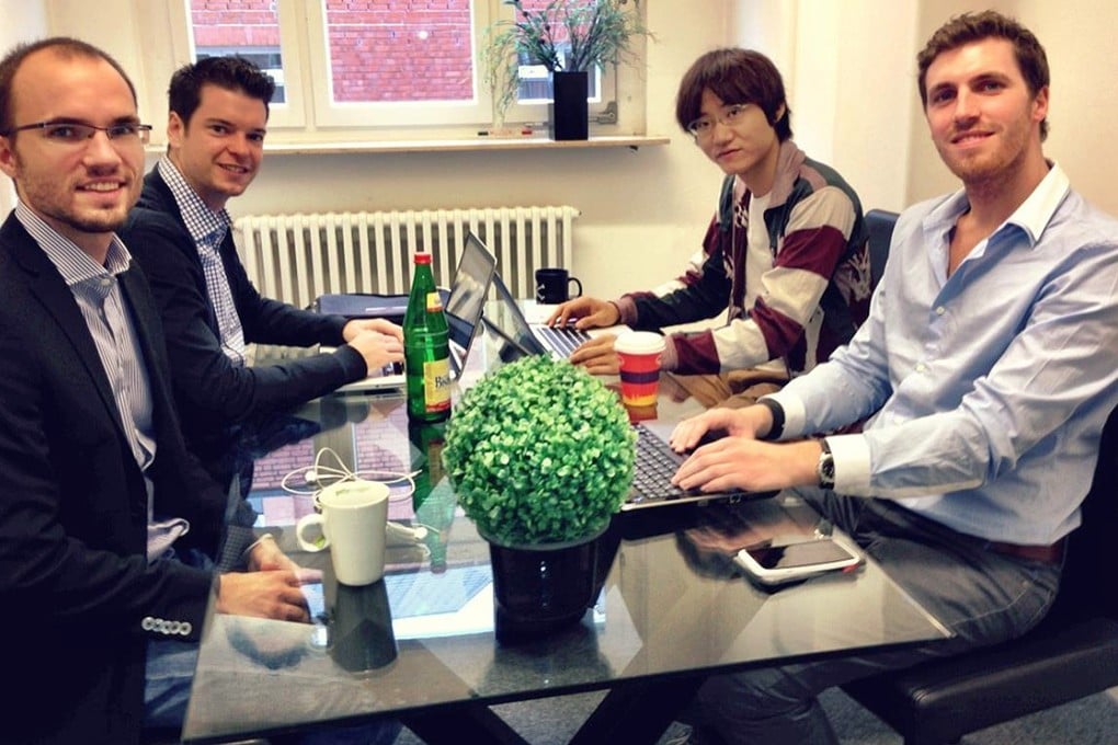 Mitsutoki Shigeta (rear right) is seen with the co-founders of mobile app Familonet in Hamburg, Germany. He has a 4 per cent stake in the company. Photo: SCMP