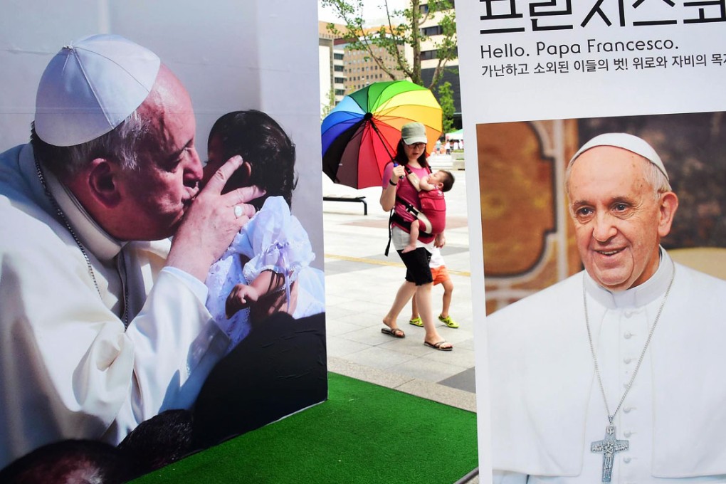 Posters for a photo exhibition on Pope Francis in Seoul. Photo: AFP
