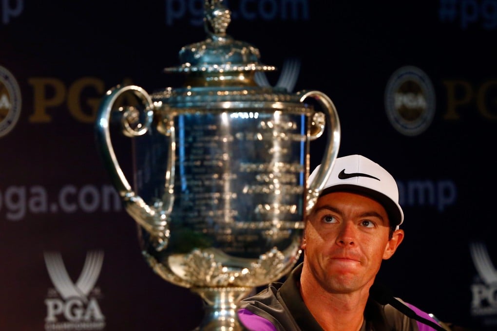Rory McIlroy admires the Wanamaker Trophy after his one-stroke victory in the PGA Championship. Photo: AFP