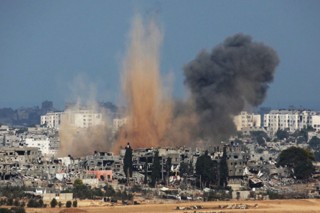 Smokes rise from the coastal side of the Gaza strip following an Israeli military strike. Photo: AFP