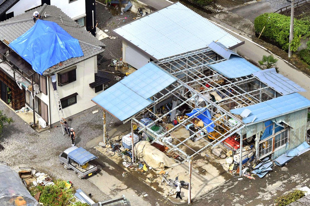 Damaged houses in Mibu, in eastern Tochigi prefecture. Photo: Kyodo