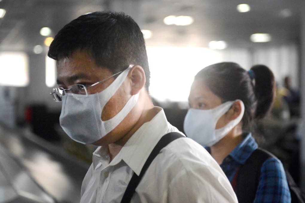 Health workers wearing protective face masks arrive at Murtala Mohammed Airport in Lagos. Photo: AFP