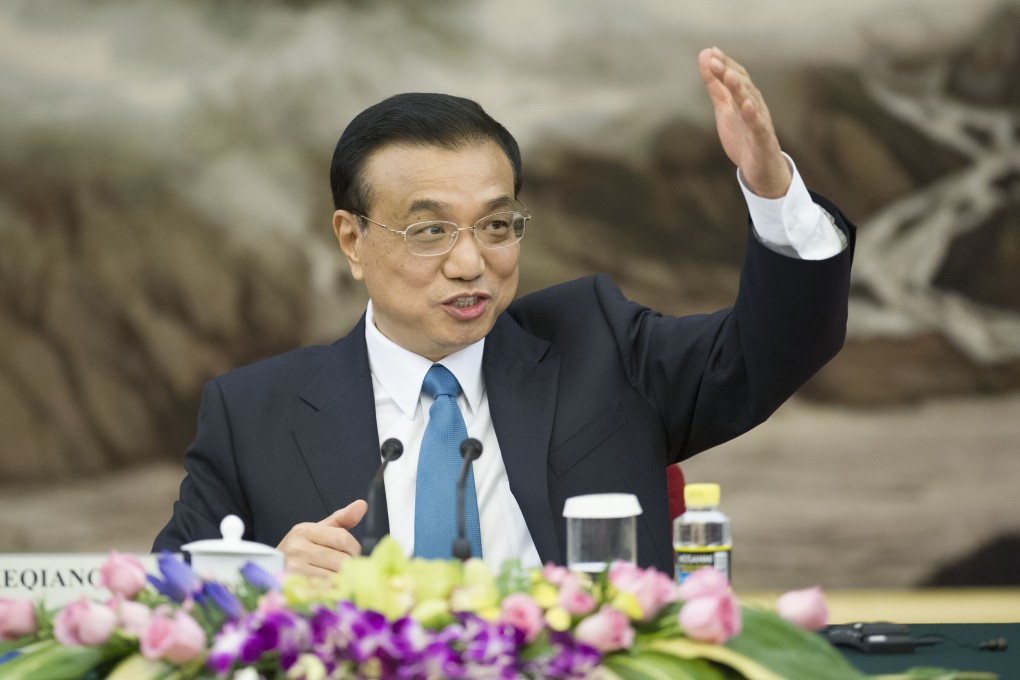 Premier Li Keqiang is grappling with sustaining economic growth and containing risks to the financial system after shadow-banking assets jumped more than 30 per cent in 2013 to 38.8 trillion yuan. Photo: Xinhua