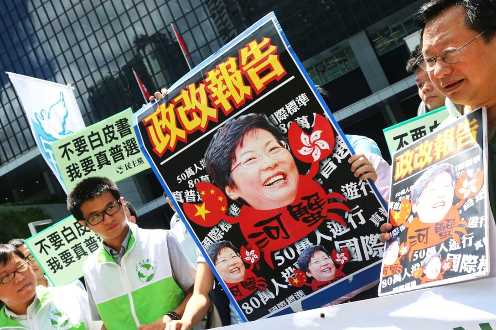 Protesters were out in force yesterday as Chief Secretary Carrie Lam Cheng Yuet-ngor spoke on electoral reform proposals at the Legislative Council. Photo: David Wong