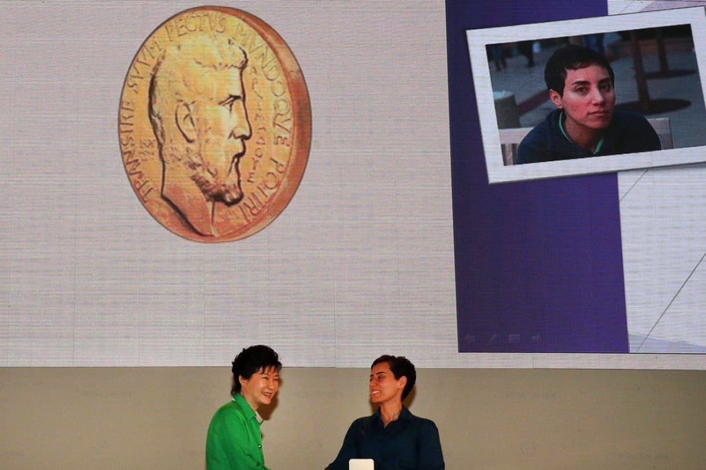 Maryam Mirzakhani (right) at the awards ceremony. Photo: AFP