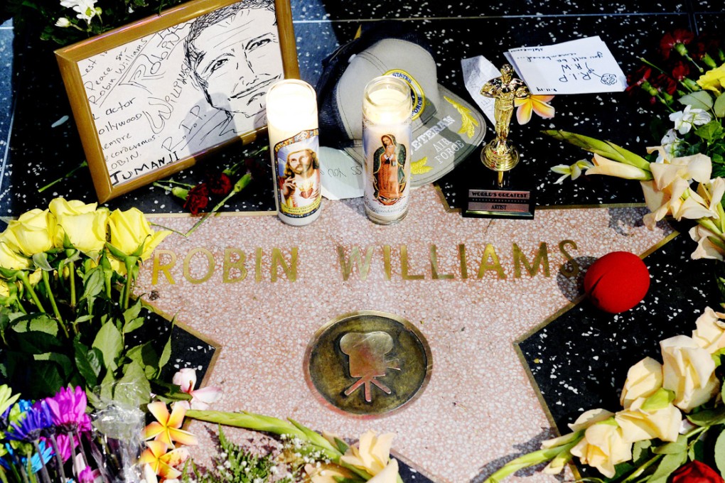 Flowers are placed in memory of actor and comedian Robin Williams on his Walk of Fame star in Hollywood. Photo: AP
