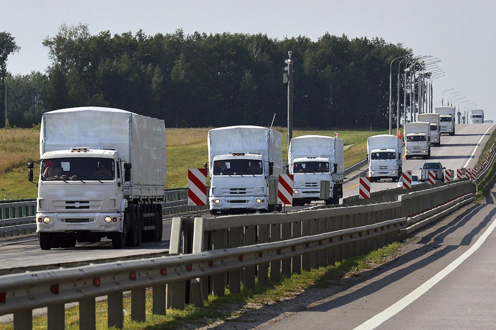 A Russian convoy of trucks carrying humanitarian aid for Ukraine drives along a road near the city of Yelets. Photo: Reuters