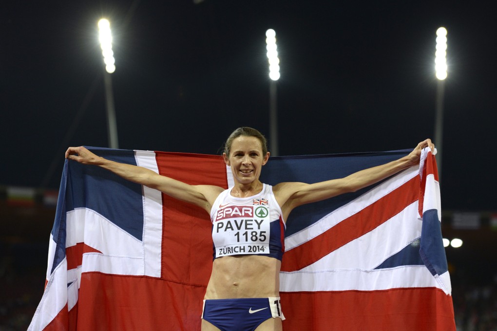 Jo Pavey celebrates with the union flag. Photo: EPA