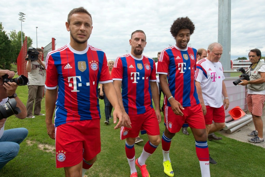 Bayern Munich players Rafinha (left), Franck Ribery and Dante arrive for an official photo for the 2014-15 season of the German Bundesliga. Ribery has retired from international duty. Photo: EPA