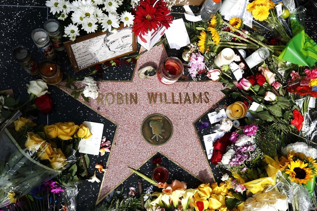 Flowers are seen on the late Robin Williams' star on the Hollywood Walk of Fame in Los Angeles. Photo: Reuters