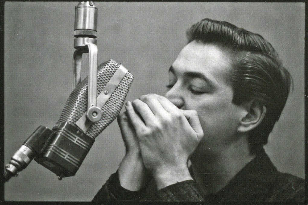 American blues musician Paul Butterfield on harmonica.