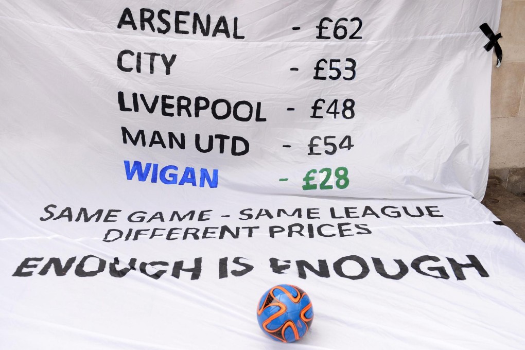 A banner shows some of the Premier League club ticket prices during a demonstration in London this week.Photo: EPA