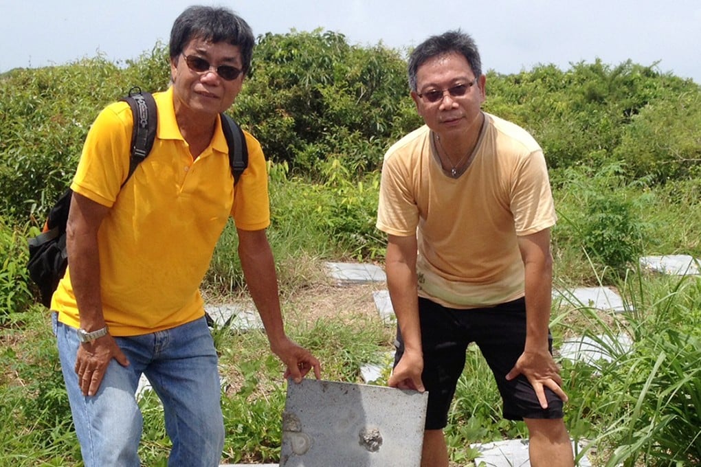 Eddie Tse, right, with a villager at a niche site. Photo: Jessie Lau