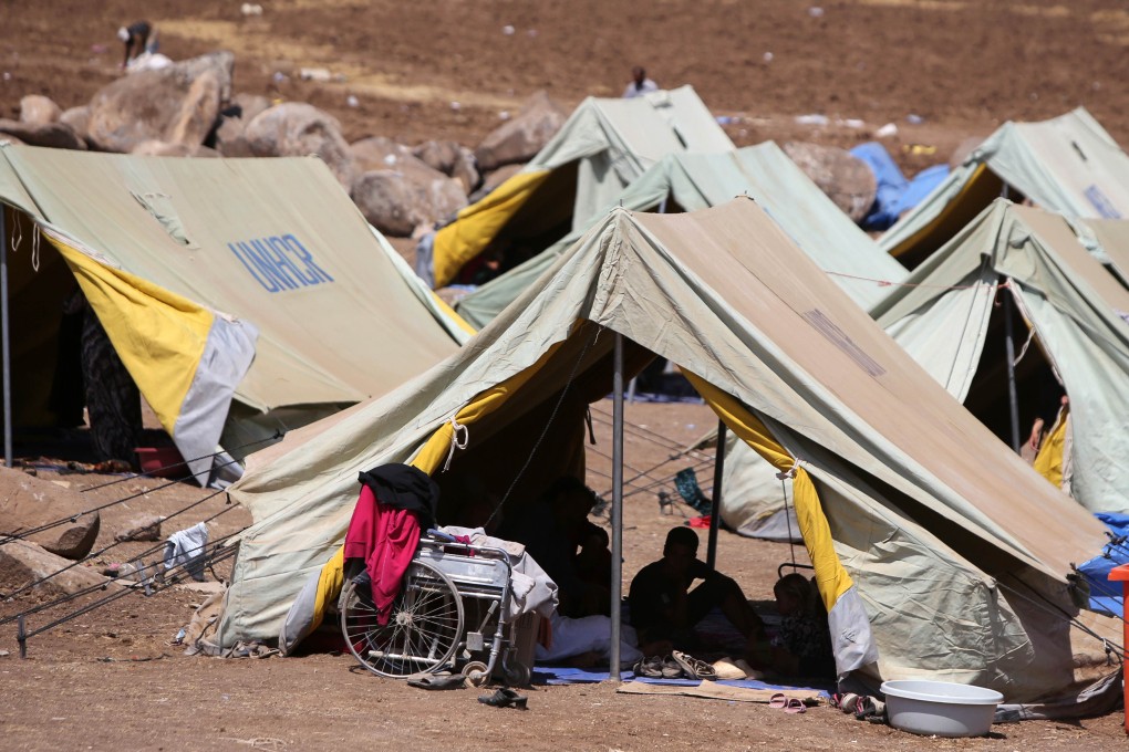 Displaced Iraqis settle in at a camp in northeastern Syria, after fleeing Islamic State militants in Iraq. Photo: AFP
