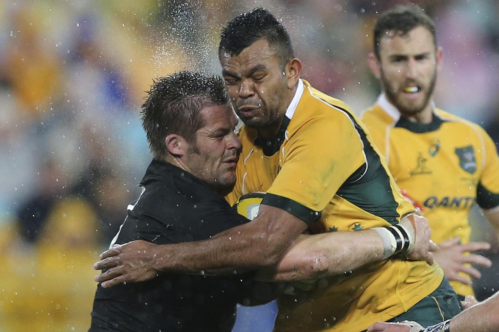 New Zealand captain Richie McCaw (left) and Australia's Kurtley Beale clash during their Rugby Championship opener. Photo: AP