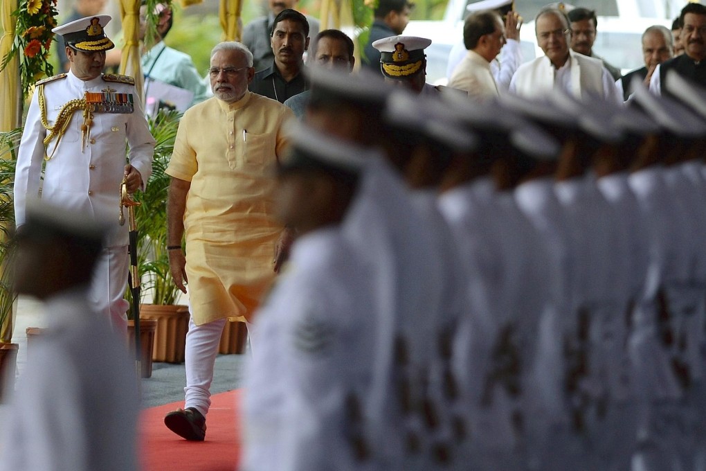 Narendra Modi arrives for the commissioning ceremony of the INS Kolkata yesterday. Photo: AFP