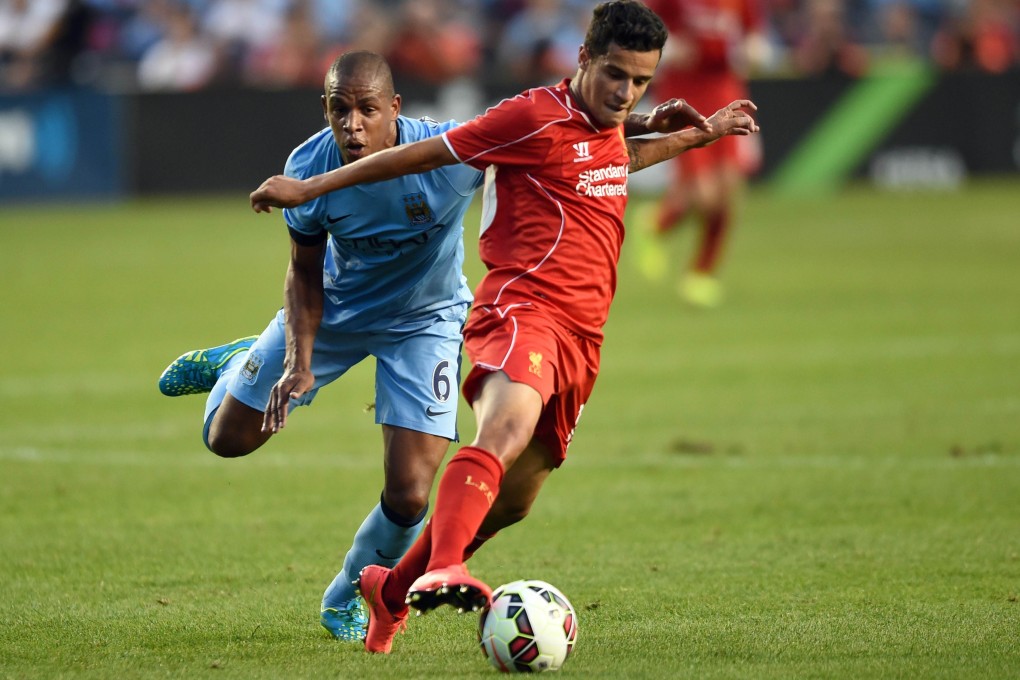 Manchester City's Fernando and Liverpool's Philippe Coutinho during the Guinness International Champions Cup at Yankee Stadium, which attracted huge crowds in the English clubs' preseason tour. Photo: AFP